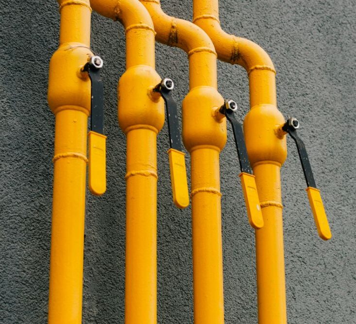 Yellow gas pipes outside a home